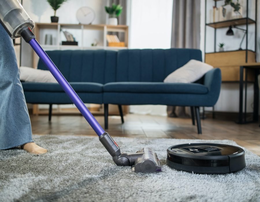 close-up-of-woman-cleaning-carpet-with-vacuum-cleaners.jpg